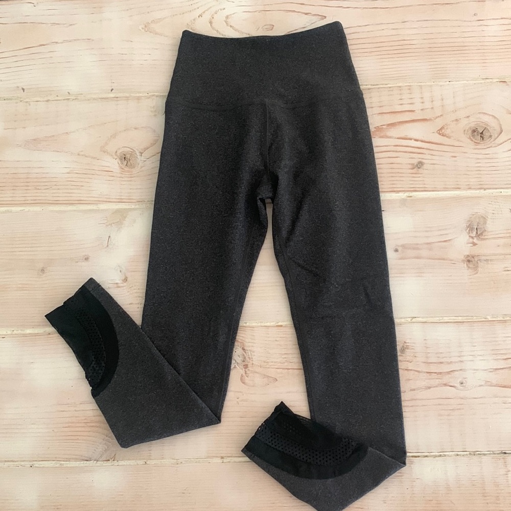 Beyond Yoga heathered grey high waisted leggings with mesh details at the ankle